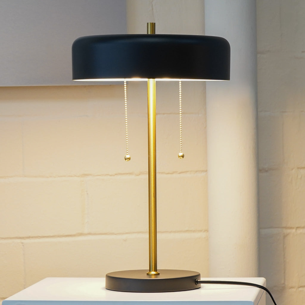 Black drum table lamp with brass stem and pull chains, image 4 of 5