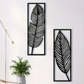 Two black metal leaf wall art panels, image 1 of 5