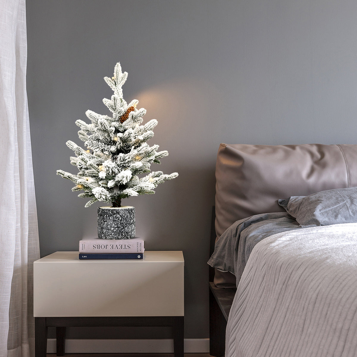 Flocked tabletop Christmas tree with pine cones in a pot, image 2 of 3