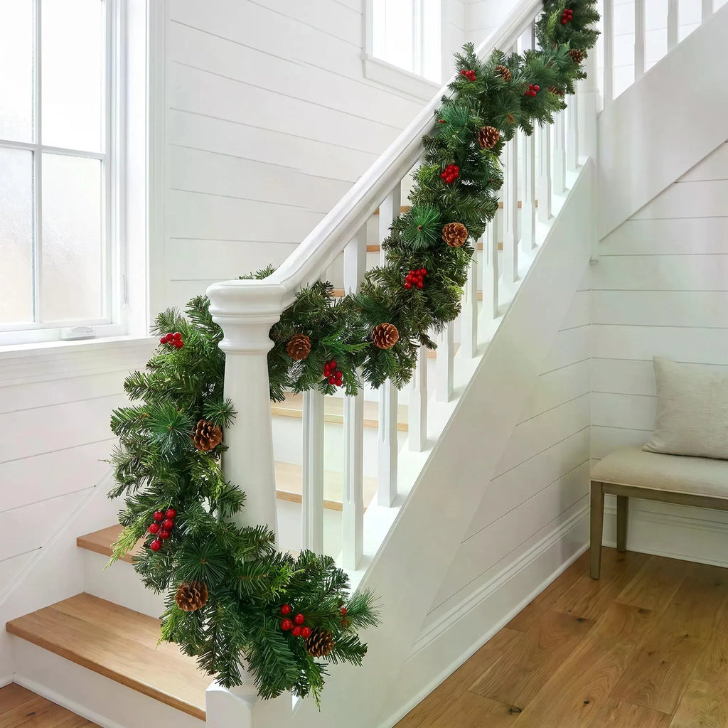Pine Christmas garland with red berries and pine cones on a mantel, image 2 of 4