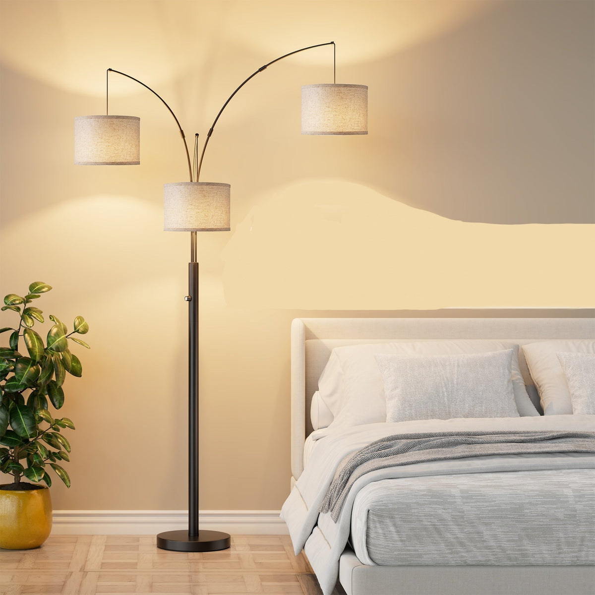 Black three-arm arc floor lamp with drum shades