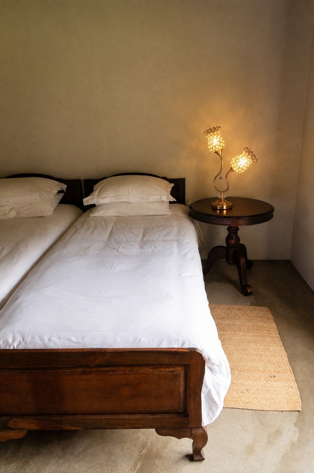 Rose gold tulip two-light table lamp, 18.75 in tall, on a bedside table