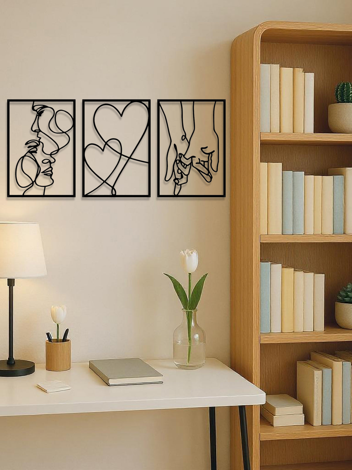 Three black metal line-art panels of a couple and a heart, image 4 of 5