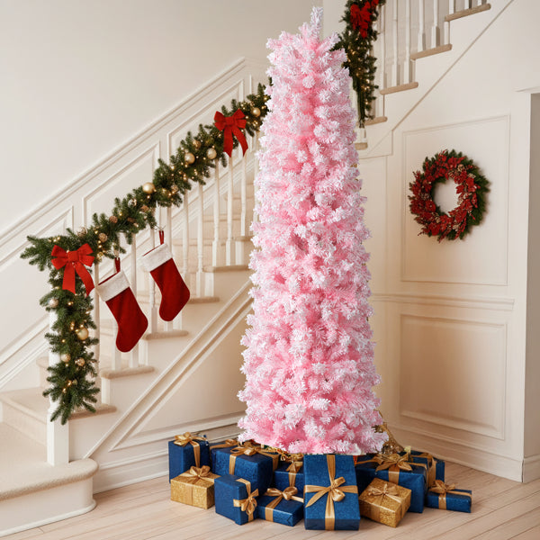 Pink snow-flocked pencil Christmas tree by a staircase, image 1 of 6