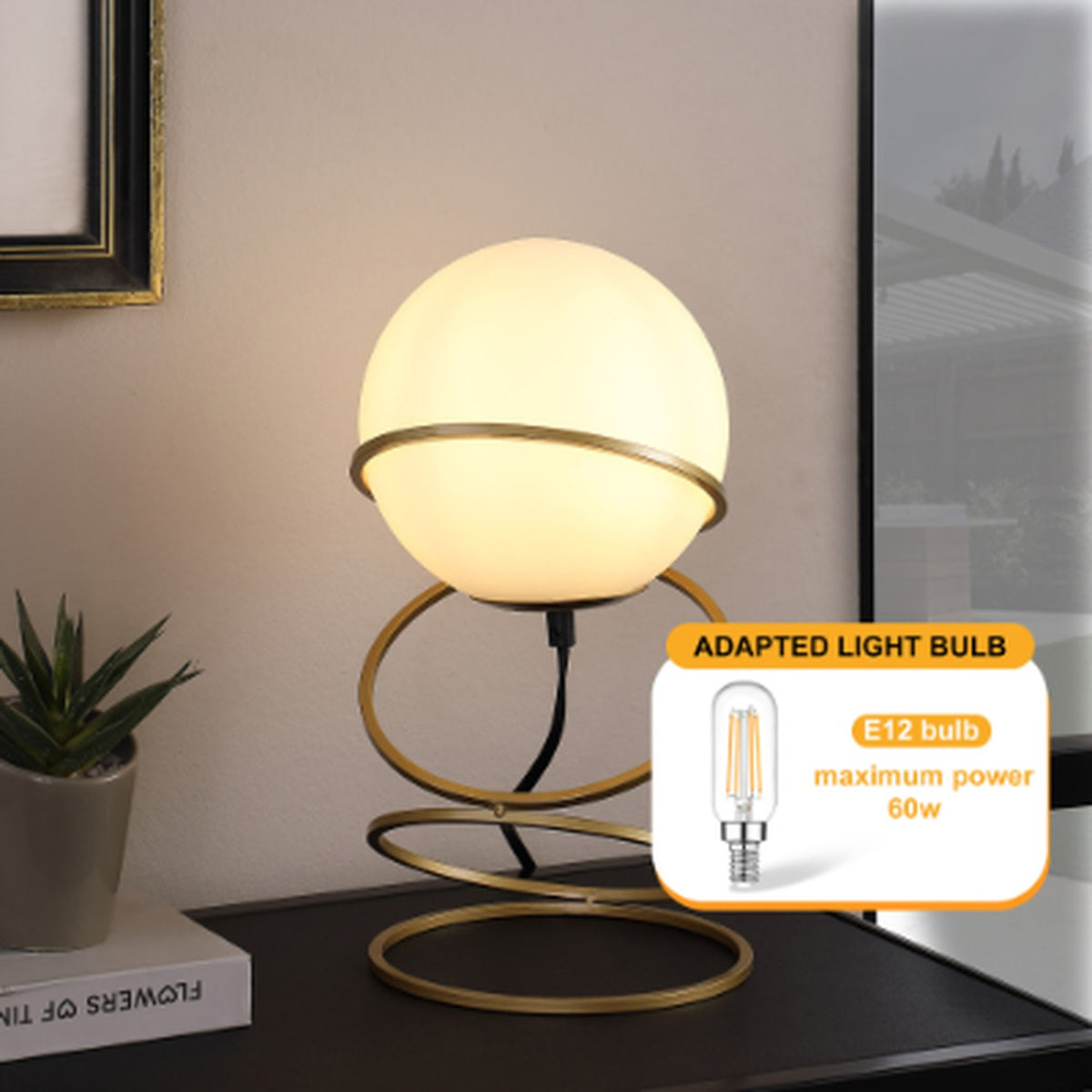 White glass globe table lamp on a matte gold spiral stand