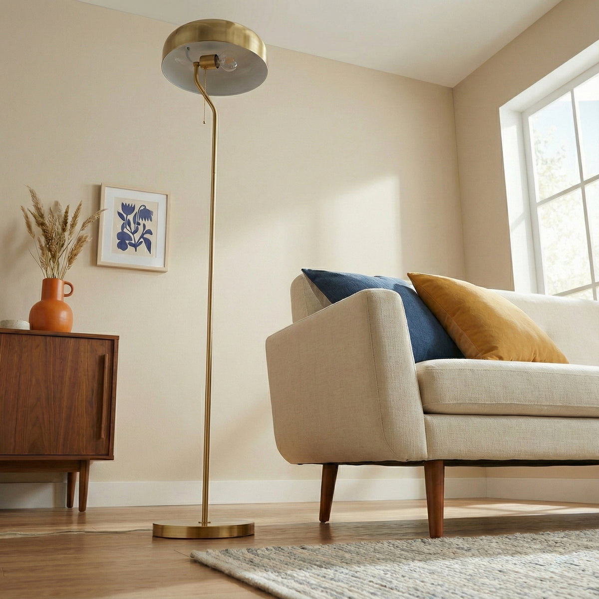 Gold dome floor lamp beside a sofa, image 2 of 5