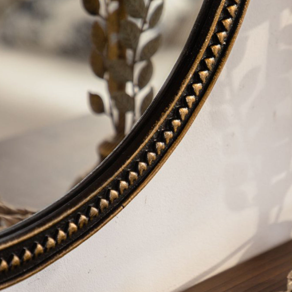 Round wall mirror with beaded gold frame above a console, image 4 of 5