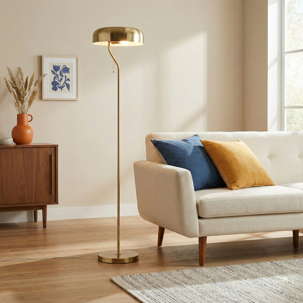 Gold dome floor lamp beside a sofa, image 4 of 5