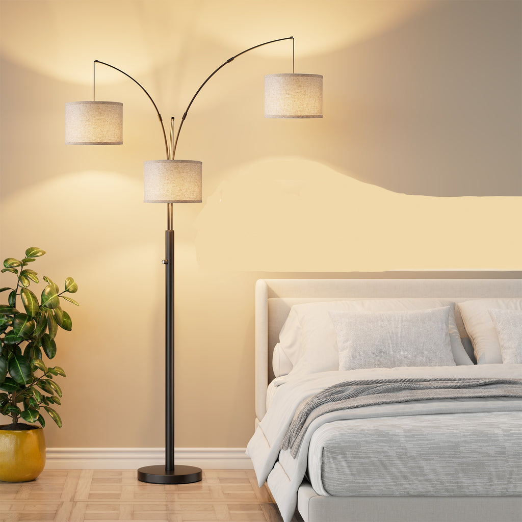 Black three-arm arc floor lamp with drum shades, image 1 of 4