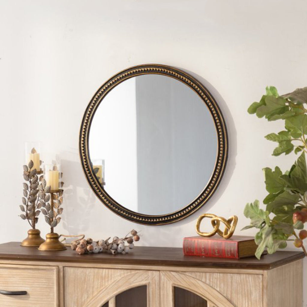 Round wall mirror with beaded gold frame above a console, image 2 of 5