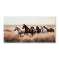 Canvas of horses in golden grassland above a sofa, image 1 of 4