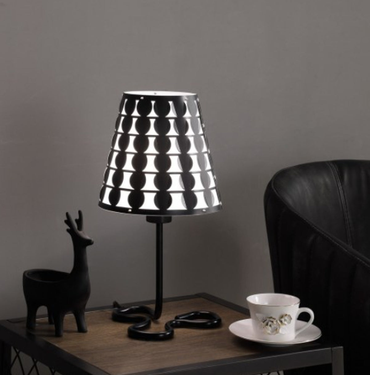 Black geometric metal table lamp with circle-pattern shade