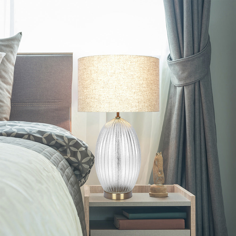 Ribbed clear glass table lamp with gold base and drum shade, image 1 of 4
