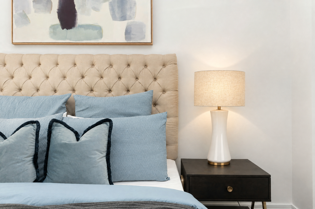 Off-White Glass Table Lamp with Gold Base and Fabric Drum Shade in a real room, wider view